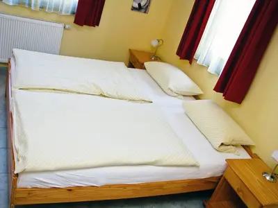 Ein Bett oder Betten in einem Zimmer der Unterkunft Hütigendachs, FW 5