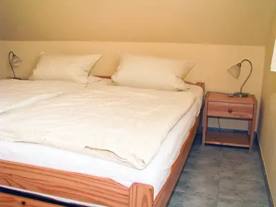 Ein Bett oder Betten in einem Zimmer der Unterkunft Hütigendachs, FW 6