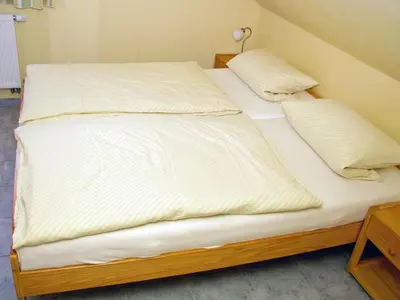 Ein Bett oder Betten in einem Zimmer der Unterkunft Hütigendachs, FW 7