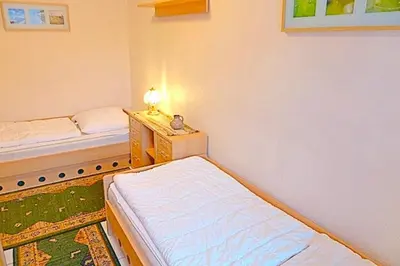 Ein Bett oder Betten in einem Zimmer der Unterkunft Kranich VIII, Whg 37