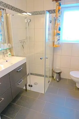 Ein Badezimmer in der Unterkunft Kranich VIII, Whg 37