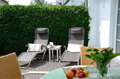 Ein Sitzbereich in der Unterkunft Strandperle 9, PP außen