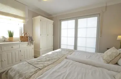 Ein Bett oder Betten in einem Zimmer der Unterkunft Strandperle 9, PP außen