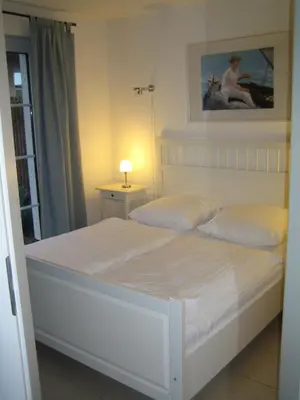 Ein Bett oder Betten in einem Zimmer der Unterkunft Carolin