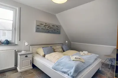 Ein Bett oder Betten in einem Zimmer der Unterkunft 54 Grad Nord
