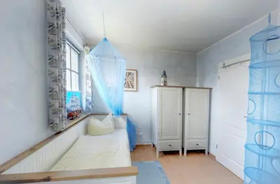 Ein Bett oder Betten in einem Zimmer der Unterkunft Antjes Deichblick