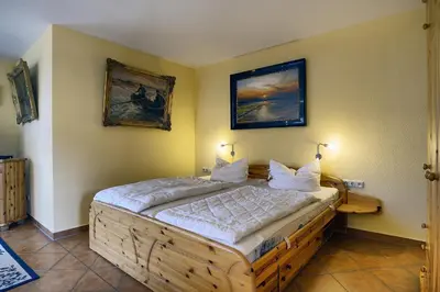 Ein Bett oder Betten in einem Zimmer der Unterkunft Kranichguck, App 1