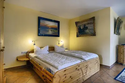 Ein Bett oder Betten in einem Zimmer der Unterkunft Kranichguck, App 2