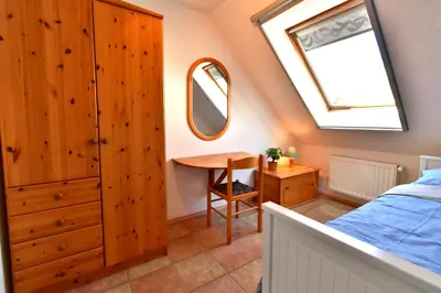 Ein Bett oder Betten in einem Zimmer der Unterkunft Strandperle 11, PP außen