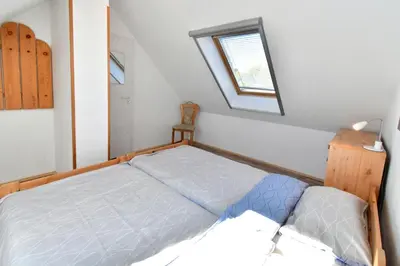Ein Bett oder Betten in einem Zimmer der Unterkunft Strandperle 11, PP außen