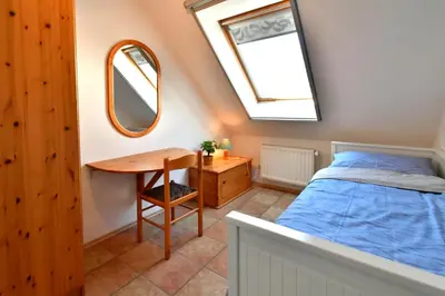 Ein Bett oder Betten in einem Zimmer der Unterkunft Strandperle 11, PP außen