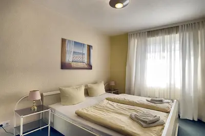 Ein Bett oder Betten in einem Zimmer der Unterkunft Residenz 