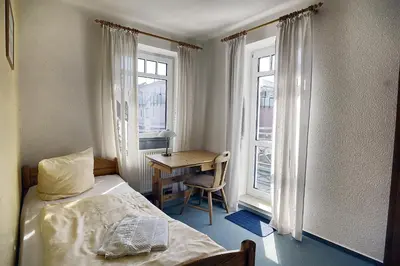 Ein Bett oder Betten in einem Zimmer der Unterkunft Residenz 