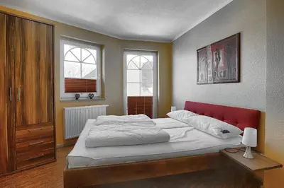 Ein Bett oder Betten in einem Zimmer der Unterkunft Villa Sonnenuhr, FW 8