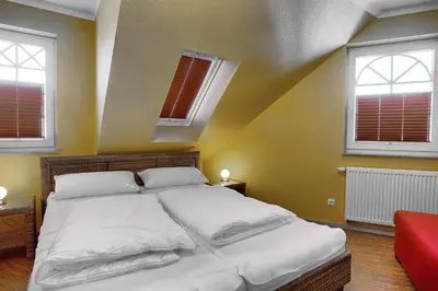 Ein Bett oder Betten in einem Zimmer der Unterkunft Villa Sonnenuhr, FW 8
