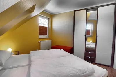 Ein Bett oder Betten in einem Zimmer der Unterkunft Villa Sonnenuhr, FW 8
