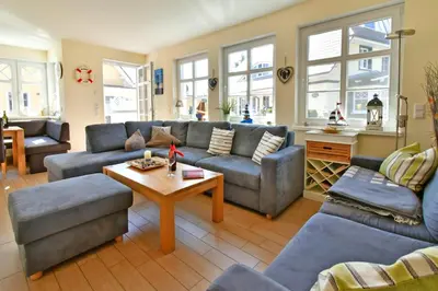 Ein Sitzbereich in der Unterkunft Haus Strandmuschel