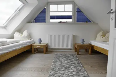 Ein Bett oder Betten in einem Zimmer der Unterkunft Dat suutsche Huus