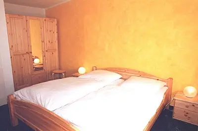 Ein Bett oder Betten in einem Zimmer der Unterkunft Windspiel, FW 2