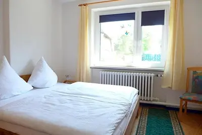 Ein Bett oder Betten in einem Zimmer der Unterkunft Windspiel, FW 3