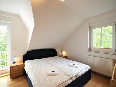Ein Bett oder Betten in einem Zimmer der Unterkunft Haus Regenbogen