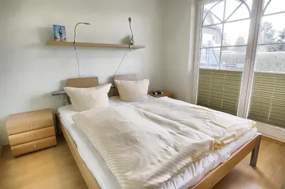 Ein Bett oder Betten in einem Zimmer der Unterkunft Villa Vogelsang, FW 2