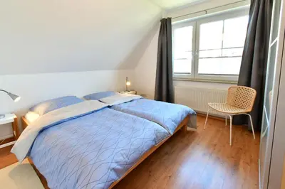 Ein Bett oder Betten in einem Zimmer der Unterkunft Ostseewelle Whg 8