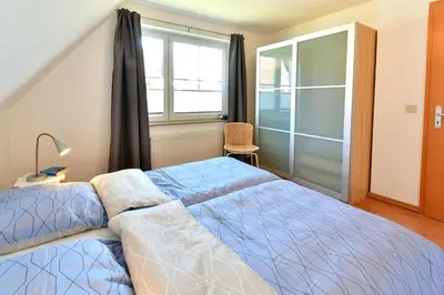Ein Bett oder Betten in einem Zimmer der Unterkunft Ostseewelle Whg 8