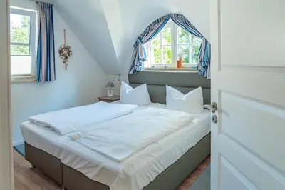 Ein Bett oder Betten in einem Zimmer der Unterkunft Gänseblümchen, FW 3
