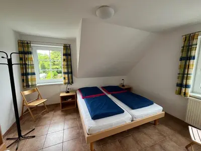 Ein Bett oder Betten in einem Zimmer der Unterkunft Ostseehaus 1