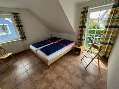 Ein Bett oder Betten in einem Zimmer der Unterkunft Ostseehaus 1