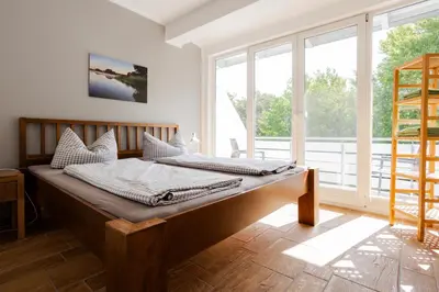 Ein Bett oder Betten in einem Zimmer der Unterkunft DER STÖRTEBEKER - 