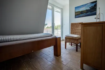 Ein Bett oder Betten in einem Zimmer der Unterkunft DER STÖRTEBEKER - 