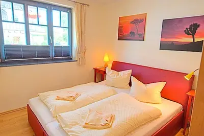 Ein Bett oder Betten in einem Zimmer der Unterkunft Villa Birkenboom, FW 1
