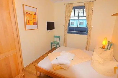 Ein Bett oder Betten in einem Zimmer der Unterkunft Villa Birkenboom, FW 1