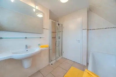 Ein Badezimmer in der Unterkunft Strandglück FH 4