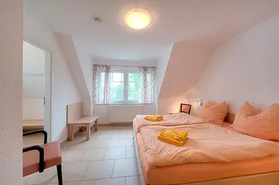 Ein Bett oder Betten in einem Zimmer der Unterkunft Strandglück FH 4