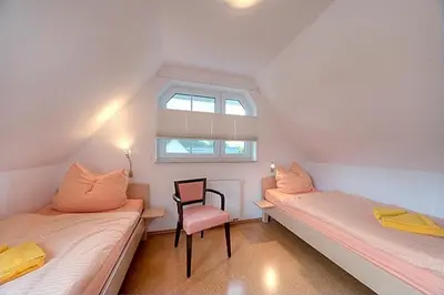 Ein Bett oder Betten in einem Zimmer der Unterkunft Strandglück FH 4
