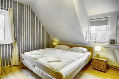 Ein Bett oder Betten in einem Zimmer der Unterkunft Strandläufer