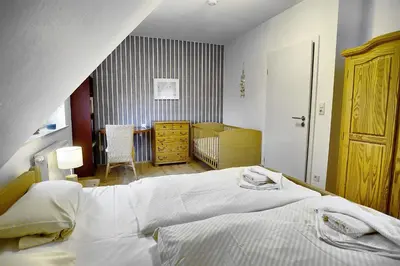 Ein Bett oder Betten in einem Zimmer der Unterkunft Strandläufer