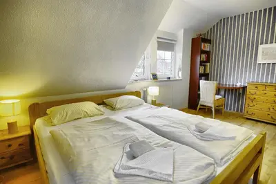 Ein Bett oder Betten in einem Zimmer der Unterkunft Strandläufer