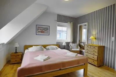 Ein Bett oder Betten in einem Zimmer der Unterkunft Strandläufer