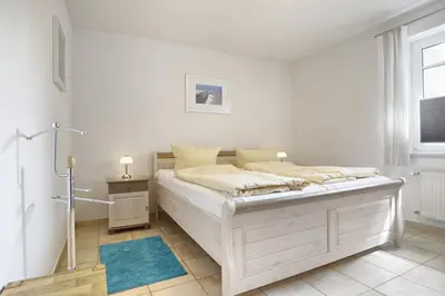 Ein Bett oder Betten in einem Zimmer der Unterkunft Vierkant FW 2