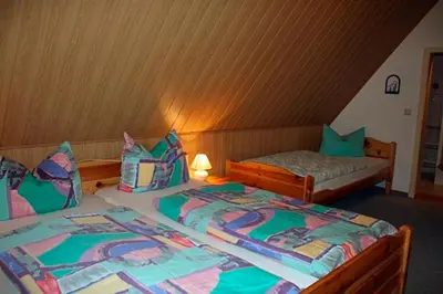 Ein Bett oder Betten in einem Zimmer der Unterkunft Voß, FW