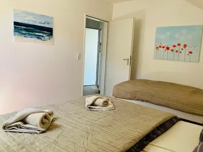 Ein Bett oder Betten in einem Zimmer der Unterkunft FEWO VI Villa Nicole Hafenstraße 37