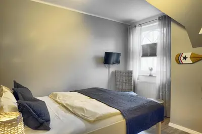 Ein Bett oder Betten in einem Zimmer der Unterkunft Villa Vogelsang, Pier 6