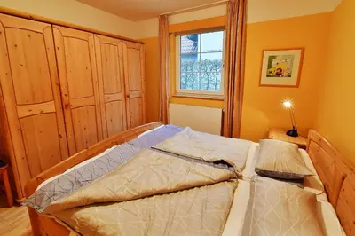 Ein Bett oder Betten in einem Zimmer der Unterkunft Haus Marleen EG, FW 1