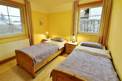 Ein Bett oder Betten in einem Zimmer der Unterkunft Haus Marleen EG, FW 1
