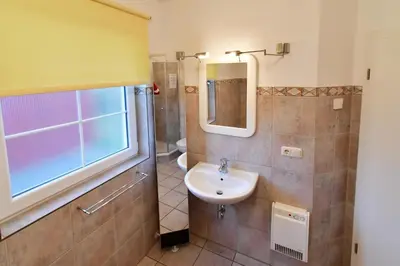 Ein Badezimmer in der Unterkunft Haus Marleen EG, FW 1