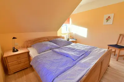 Ein Bett oder Betten in einem Zimmer der Unterkunft Haus Marleen OG, FW 2